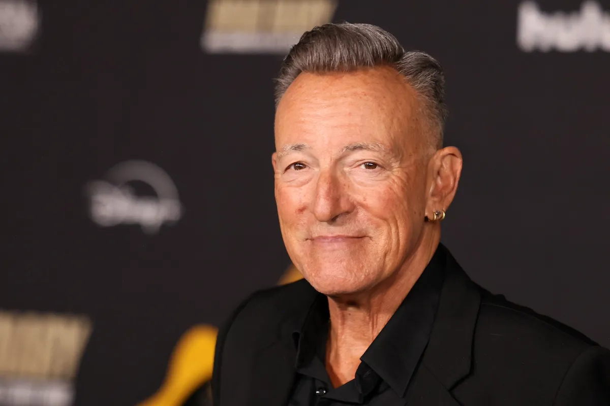 Bruce Springsteen wears a black shirt.