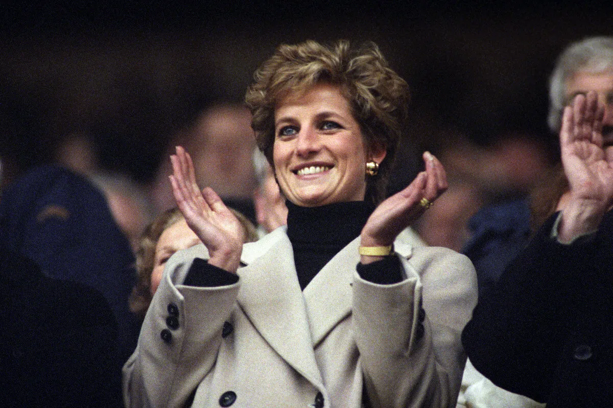 Princess Diana, who made George Michael and Liza Minnelli feel the same, claps.
